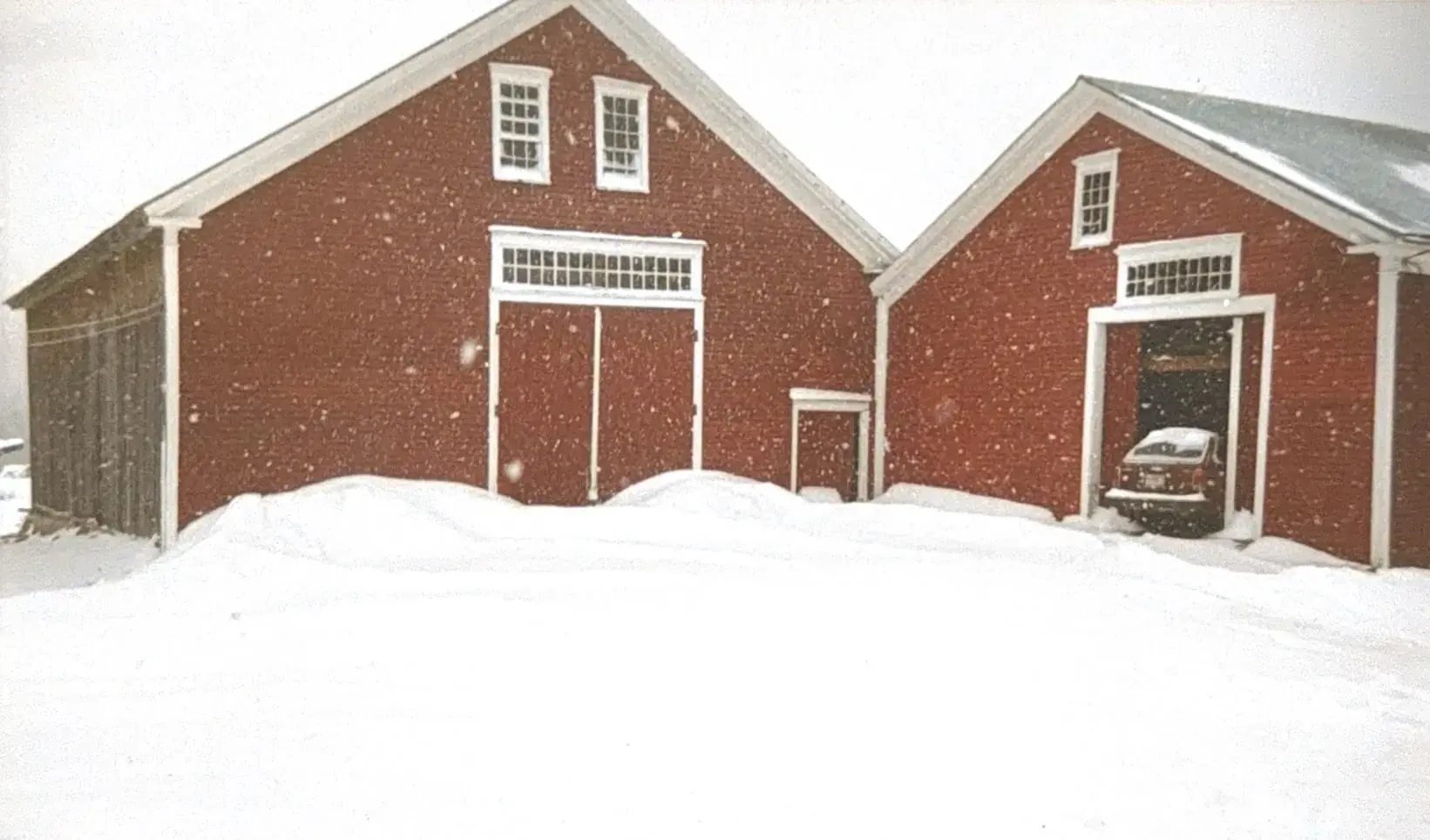 The South Road Farm barns buried in heavy snow, 1990s